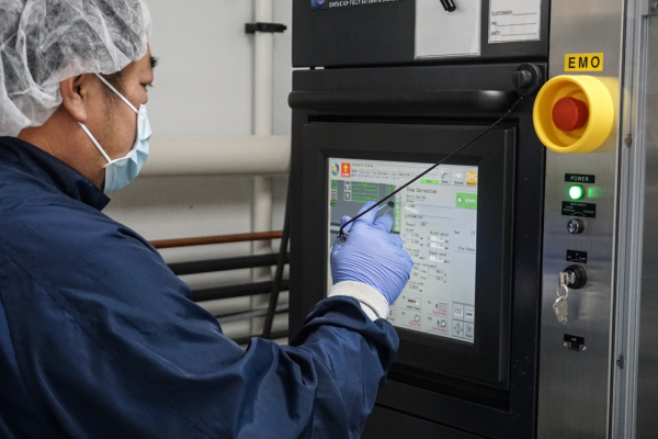 Operator programming the Disco Wafer Backgrinder